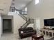 Open living room featuring a second-story view, wood floors, and contemporary furniture at 10351 W Deanna Dr, Peoria, AZ 85382
