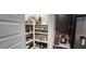 Organized walk-in pantry featuring shelving with food containers and clear storage solutions at 10351 W Deanna Dr, Peoria, AZ 85382