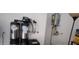 This indoor utility room features a water filtration system and a hot water heater at 10351 W Deanna Dr, Peoria, AZ 85382