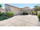 Charming single-story home with a two-car garage, beautiful landscaping, and tile roof at 10458 N 101St St, Scottsdale, AZ 85258