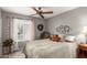 Inviting bedroom with a decorative wreath, neutral colors, and a large window for plenty of sunshine at 1214 W Sand Dune Dr, Gilbert, AZ 85233