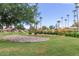 Picturesque community featuring lush landscaping, scenic walking paths, and well-maintained green spaces at 1214 W Sand Dune Dr, Gilbert, AZ 85233