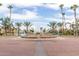 Community entrance with lush landscaping and a decorative fountain at 1214 W Sand Dune Dr, Gilbert, AZ 85233
