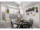 Bright dining nook with a bay window, built-in seating, and stylish light fixture at 1214 W Sand Dune Dr, Gilbert, AZ 85233