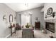 Elegant dining room with a chandelier and fireplace, perfect for entertaining at 1214 W Sand Dune Dr, Gilbert, AZ 85233