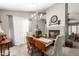 Bright dining room with stylish chandelier, fireplace, and elegant decor, creating a welcoming atmosphere at 1214 W Sand Dune Dr, Gilbert, AZ 85233