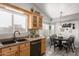 Open kitchen with a breakfast nook featuring bright natural light, dark accents, and neutral decor at 1214 W Sand Dune Dr, Gilbert, AZ 85233