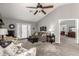 Bright living room with plush seating and French door access to backyard at 1214 W Sand Dune Dr, Gilbert, AZ 85233