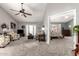 Bright living room featuring vaulted ceilings and seamless bedroom access at 1214 W Sand Dune Dr, Gilbert, AZ 85233