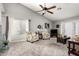 Cozy living room with a ceiling fan and a view of the backyard at 1214 W Sand Dune Dr, Gilbert, AZ 85233