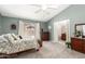 Serene primary bedroom with a view to the backyard and en-suite bath, offering comfort and privacy at 1214 W Sand Dune Dr, Gilbert, AZ 85233