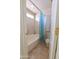 Bright bathroom featuring a tub with tile surround and a patterned shower curtain at 1219 E Avenida Isabela --, Casa Grande, AZ 85122