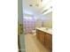 Bright bathroom with a single vanity and a colorful floral shower curtain at 1219 E Avenida Isabela --, Casa Grande, AZ 85122