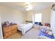 Cozy bedroom with neutral carpet, a full-size bed, and bright natural light at 1219 E Avenida Isabela --, Casa Grande, AZ 85122