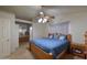 Comfortable bedroom with a bed, ceiling fan and access to the bathroom at 1219 E Avenida Isabela --, Casa Grande, AZ 85122