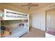 Bright bedroom featuring a white bunk bed, closet, and neutral walls for a cozy atmosphere at 1219 E Avenida Isabela --, Casa Grande, AZ 85122