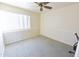 Bright bedroom with neutral carpeting, and a ceiling fan at 1219 E Avenida Isabela --, Casa Grande, AZ 85122