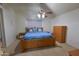 Comfortable bedroom with a ceiling fan and natural light from the window at 1219 E Avenida Isabela --, Casa Grande, AZ 85122