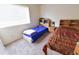 Shared bedroom with two beds, shelving units and natural light from the windows at 1219 E Avenida Isabela --, Casa Grande, AZ 85122