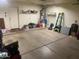Clean two car garage with plenty of shelving storage and an outside door at 1219 E Avenida Isabela --, Casa Grande, AZ 85122