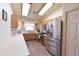 Well-lit kitchen featuring modern appliances, wooden cabinetry, and ample counter space at 1219 E Avenida Isabela --, Casa Grande, AZ 85122