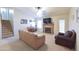 Inviting living area featuring a fireplace, comfortable seating, and an open staircase at 1219 E Avenida Isabela --, Casa Grande, AZ 85122