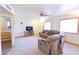Large living room with comfortable sofa, recliner and carpeting at 1219 E Avenida Isabela --, Casa Grande, AZ 85122