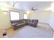 Spacious living room featuring plush carpeting, neutral walls, and a comfortable sectional sofa at 1219 E Avenida Isabela --, Casa Grande, AZ 85122