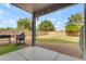 Covered patio with BBQ area and view of landscaped yard at 1405 S Honeysuckle Cir, Gilbert, AZ 85296