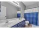 Modern bathroom with a double vanity, blue accents, and great lighting at 1405 S Honeysuckle Cir, Gilbert, AZ 85296
