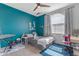 This vibrant bedroom features bold colors, playful decor, and a ceiling fan at 1405 S Honeysuckle Cir, Gilbert, AZ 85296