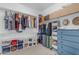 Walk-in closet with ample shelving, hanging racks, and storage space for organized wardrobe at 1405 S Honeysuckle Cir, Gilbert, AZ 85296