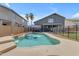 A stunning private backyard pool is surrounded by patio and lush landscaping, perfect for relaxation and outdoor entertaining at 1405 S Honeysuckle Cir, Gilbert, AZ 85296