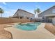 Backyard pool with rock detail, fenced area, and patio at 1405 S Honeysuckle Cir, Gilbert, AZ 85296