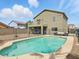 Backyard view showing a pool area with lounge seating, ideal for relaxation and entertainment at 14626 N 132Nd Ave, Surprise, AZ 85379