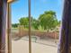 Private balcony offering views of lush greenery, mature landscaping, and the sparkling pool below at 14626 N 132Nd Ave, Surprise, AZ 85379