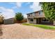 A low-maintenance backyard with a two-story home featuring ample natural light and a storage shed at 14727 W Pasadena Ave, Litchfield Park, AZ 85340