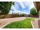 Expansive backyard features low-maintenance landscaping and a storage shed at 14727 W Pasadena Ave, Litchfield Park, AZ 85340