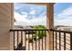 This is a balcony view overlooking rooftops and landscape with mountains in the background at 14727 W Pasadena Ave, Litchfield Park, AZ 85340