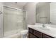 Bright bathroom featuring a glass-enclosed shower, toilet, and vanity with sink at 14727 W Pasadena Ave, Litchfield Park, AZ 85340