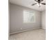 Bright bedroom featuring a ceiling fan, a window, and carpeted floors at 14727 W Pasadena Ave, Litchfield Park, AZ 85340
