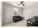 Spare bedroom furnished with a black loveseat and carpeted floors at 14727 W Pasadena Ave, Litchfield Park, AZ 85340