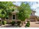 Charming home featuring a well-maintained yard with stone accents and a brick driveway at 14727 W Pasadena Ave, Litchfield Park, AZ 85340