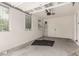 Empty garage with windows and white walls at 14727 W Pasadena Ave, Litchfield Park, AZ 85340