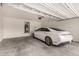 Garage containing a parked white car at 14727 W Pasadena Ave, Litchfield Park, AZ 85340