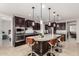 The kitchen is equipped with stainless steel appliances, an island, and barstool seating at 14727 W Pasadena Ave, Litchfield Park, AZ 85340