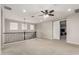 A large loft area featuring carpet, railings, and lots of natural light at 14727 W Pasadena Ave, Litchfield Park, AZ 85340