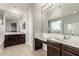 Main bathroom featuring double sinks and large mirror at 14727 W Pasadena Ave, Litchfield Park, AZ 85340