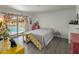 Bright bedroom with a sliding glass door providing access to the backyard pool area at 1540 E Glencove St, Mesa, AZ 85203
