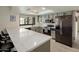 Modern kitchen with stainless steel appliances, gray cabinets, and quartz countertops at 1540 E Glencove St, Mesa, AZ 85203
